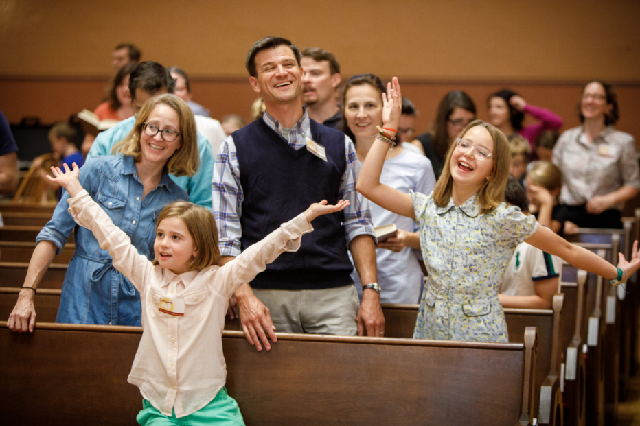 family dancing in worship