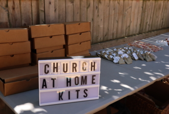 a sign saying "church at home kits"