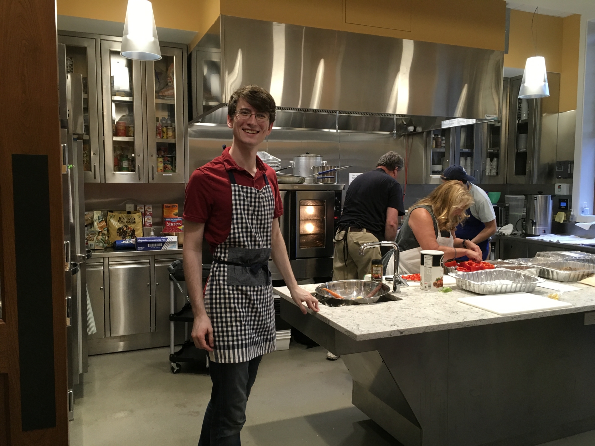 young man helping in the kitchen