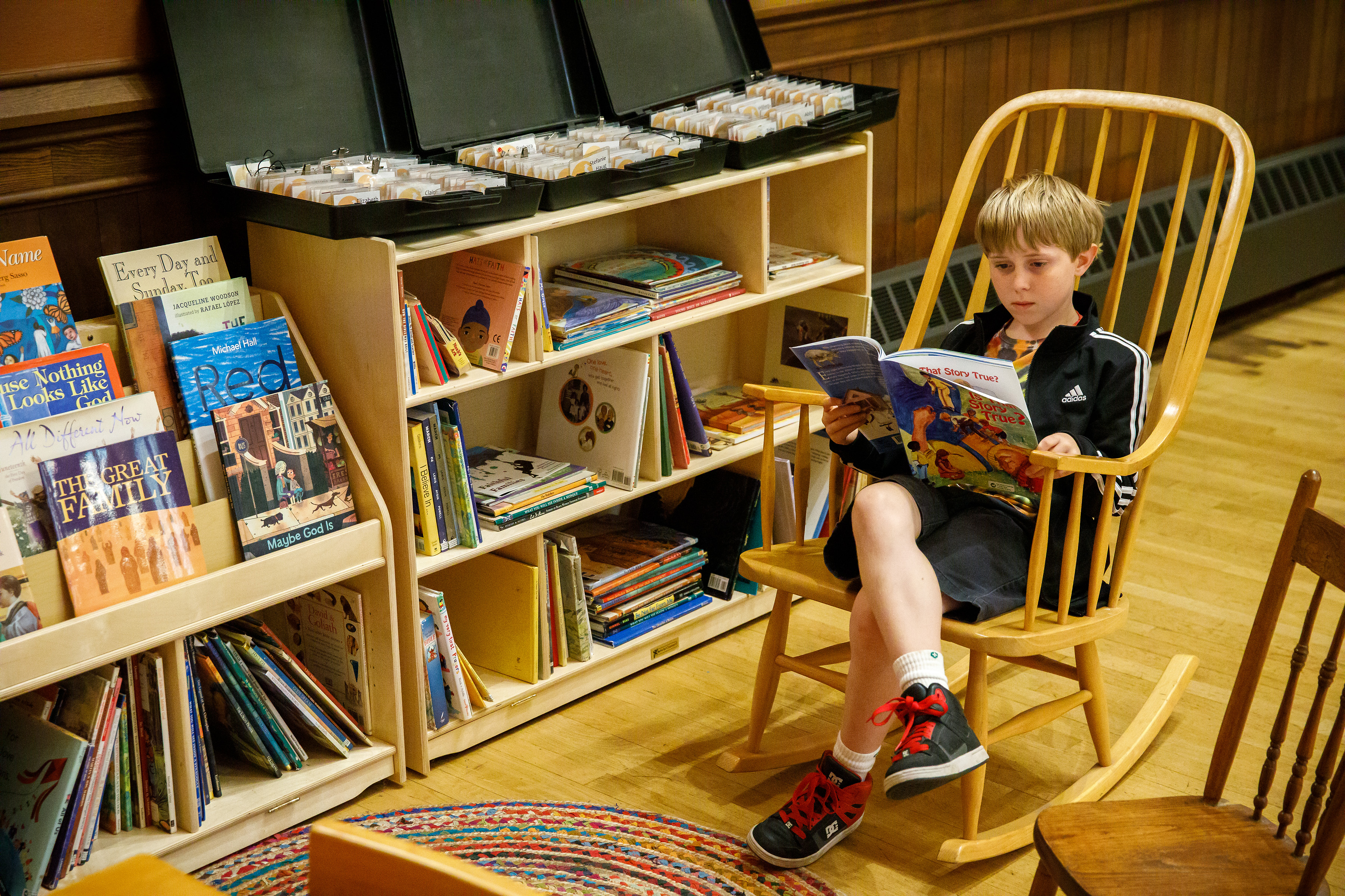 boy reading in a book corner