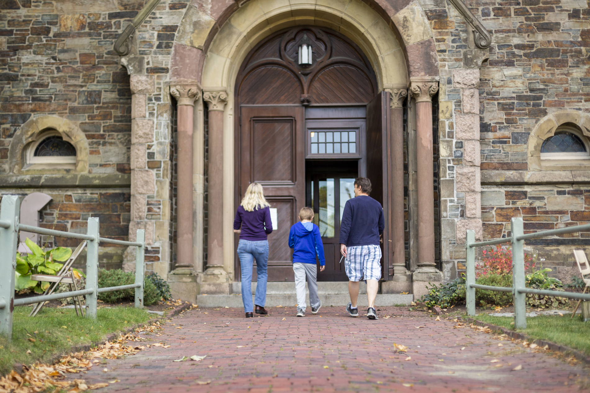 family walking towards church door